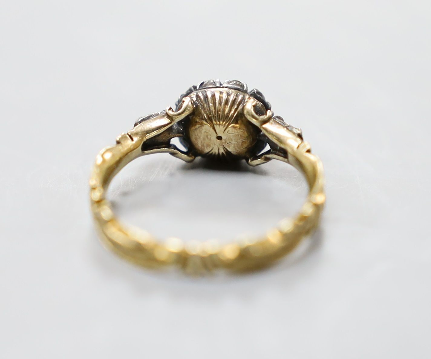 A late 18th century gold and old cut diamond set circular cluster ring
